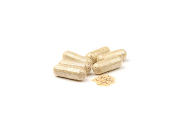 Herbal capsules isolated on white background.