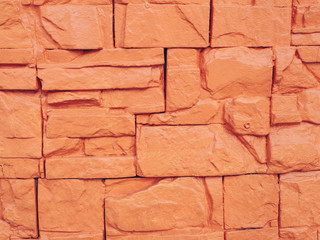 Close-up of orange stones and cement