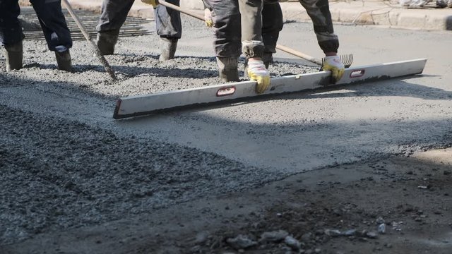 builders poured concrete at the construction site