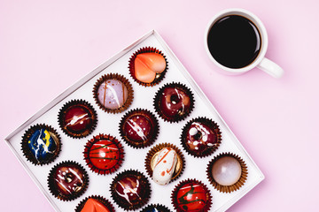 Box of Tasty Chocolate Candies and Cup of Coffee Homemade Cocolate Candy Tasty and Beautiful Dessert Top View Long