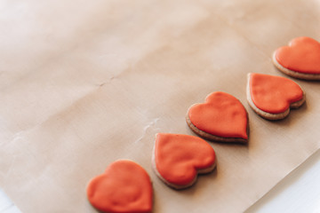 heart-shaped cookies on baking parchment