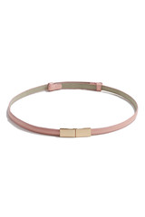 Subject shot of a thin belt made of pale pink patent leather and decorated with a golden buckle made as two right angled parts. The stylish belt is isolated on the white background.