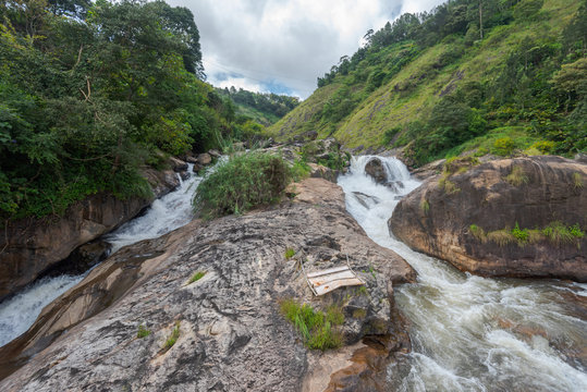 Atukkad Waterfalls near Munnar in Kerala, South India on cloudy day in rain season