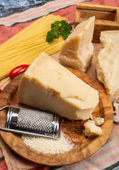 Cooking with hard italian cheese, grated parmesan or grana padano cheese
