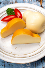 White and smoked yellow italian scamorza cheese