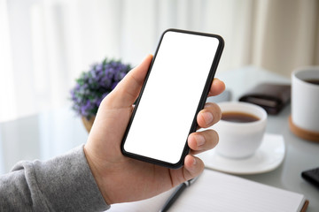 male hand holding phone with isolated screen in the office