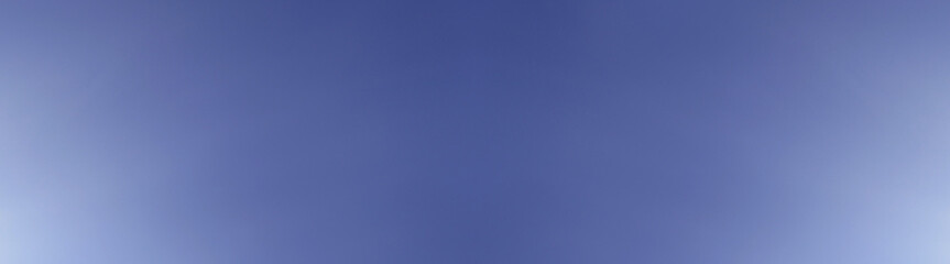 Blue clear sky. Sunlight on the sky. Abstract blue background. The sky without clouds. Copy space.