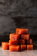 dices of quince cheese on a table
