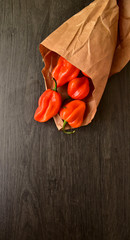 red pepper on wooden background 
