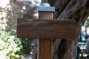 Wood sign mockup, forest trees background, copy space