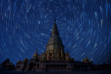 The stars night of startails over Wat Phra Bat Huai Tom. Places of worship Buddha Relics Pagoda off thailand