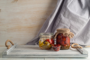 Homemade canned pickled and fermented vegetables for long-term storage.