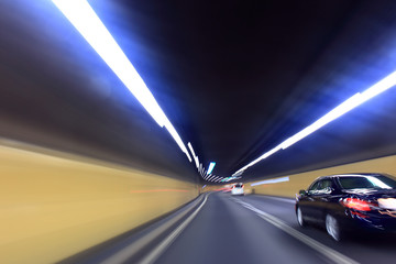 Fototapeta na wymiar Car driving through tunnel