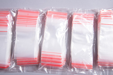 Lot of zipper storage bags, slider storage bags ob grey background