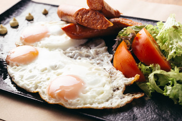 toast eggs and sausages served on plate