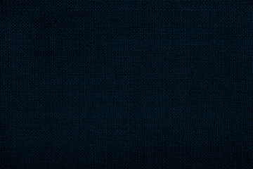 Close up texture of natural weave cloth in dark blue or teal color. Fabric texture of natural...