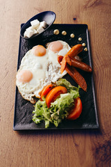 toast eggs and sausages served on plate