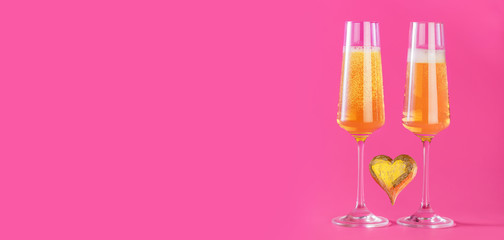 Valentines day background with champagne glasses and gold heart