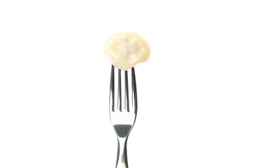 Fork with dumpling isolated on white background