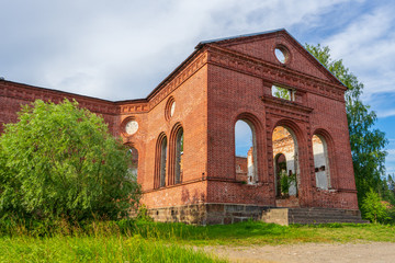 Fototapeta na wymiar Ruined Lutheran church in Lahdenpohja, Karelia, Russia. Destroyed protestant temple in summer day. Architectural landmark in northern Russian town with Finnish heritage. Background for history theme
