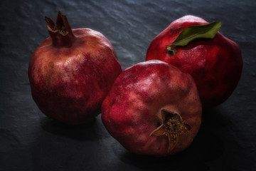 Ripe and juicy pomegranate fruits close-up