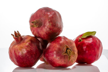 Ripe and juicy pomegranate fruits close-up