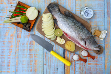 Barramundi or asian seabass fish with alarm clock , salt, msg,ginger,garlic,onion,key lime, chilies...
