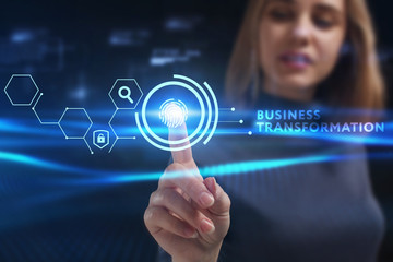 Business, Technology, Internet and network concept. Young businessman working on a virtual screen of the future and sees the inscription: Business transformation