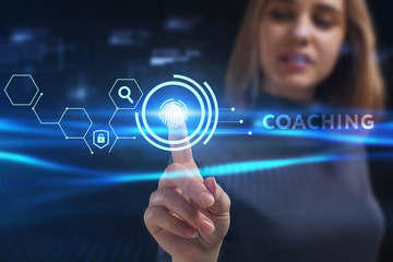 Business, Technology, Internet and network concept. Young businessman working on a virtual screen of the future and sees the inscription: Coaching