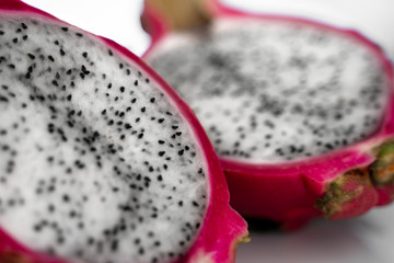 Dragon fruit. Vibrant Dragon Fruit on white background. Sliced white dragon fruit or pitaya on...