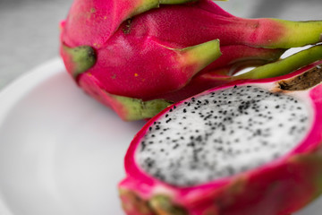 Dragon fruit. Vibrant Dragon Fruit on white background. Sliced white dragon fruit or pitaya on...
