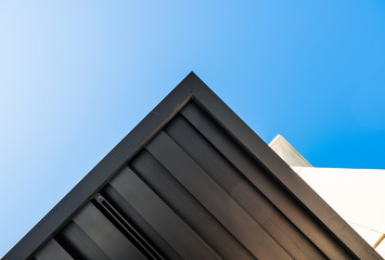 Fototapeta na wymiar Abstract triangle angled corner of building structure. Abstract color and design. Architectural detail and design. Isolated architecture detail. Abstract architecture detail Minimal design and art.