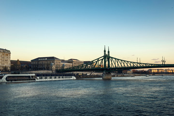 Fototapeta na wymiar Fragment of Liberty Bridge and Pest Embankment in the city of Budapest, Hungary.