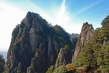 Huangshan Mountain in Anhui Province, China. Scenic view of mountain peaks, cliffs and trees in the West Sea or Xi Hai canyon on Huangshan. From the West Sea path on Huangshan Mountain, China.