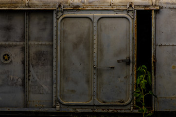 Vintage railroad container doors without rusty and old color at station.