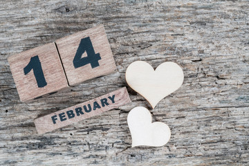 valentines day greeting template on wooden background with February cube calendar