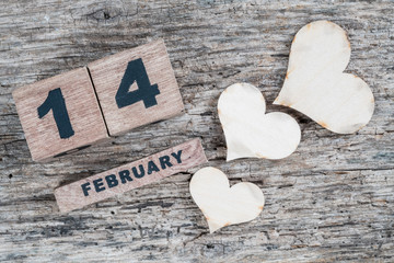 valentines day greeting template on wooden background with cube calendar