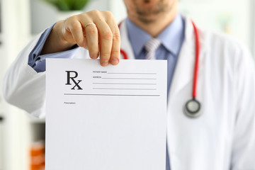 Male medicine doctor hand hold and give prescription form to patient - obrazy, fototapety, plakaty