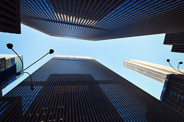 Fototapeta na wymiar Worm's-eye view architecture background in Manhattan, New York, NY, USA.