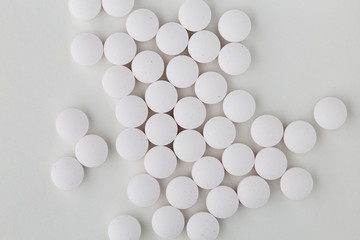 Pills tablets vitamins capsules drugs white close up macro shot