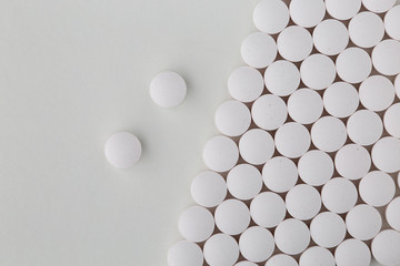 Pills tablets vitamins capsules drugs white close up macro shot
