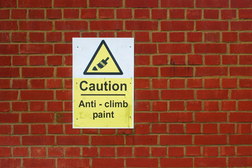 Anti-climb warning sign