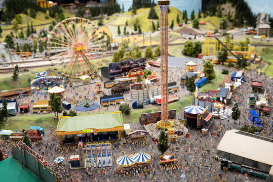 Miniature amusement park crowded with people