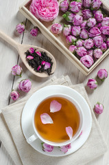 Cup of tea with rose petals