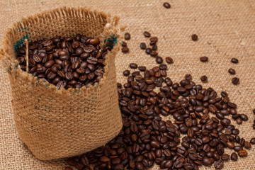Roasted coffee beans in a canvas sack