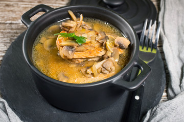 Stewed pork loin with mushrooms.