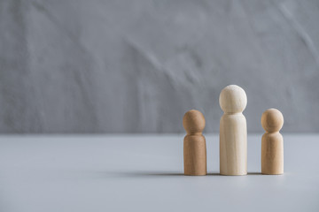 ingle father with two children. Divorce and breaking of relations. Concept made from wooden men people