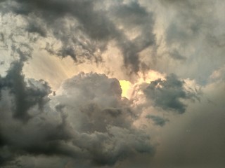 sun hidden behind the clouds