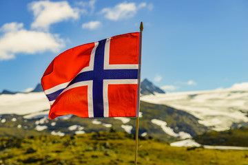 Norwegian flag and mountains snowy landscape