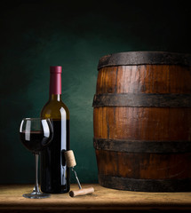 Bottle of wine with corkscrew on wooden background - obrazy, fototapety, plakaty